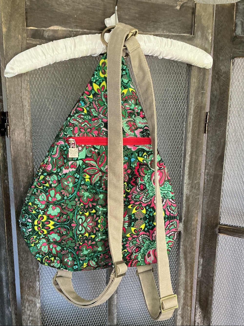 Colorful Floral Sling Backpack with Pink Accent